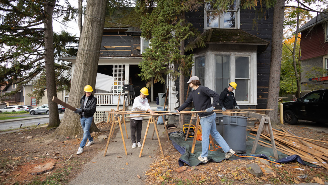 Workers deconstructing a house in Ithaca in 2022.