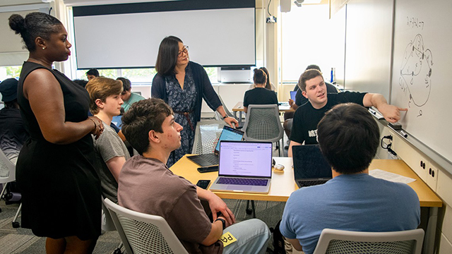 Students work with Jamila Walida Simon and Hua Wang.